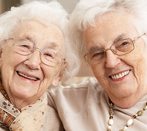 Two smiling elderly women. 