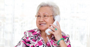 Older woman smiling while talking on the phone