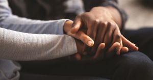 two people holding hands