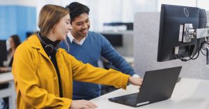TIO team members working in the office