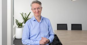 Photo of Glen Noonan in an office